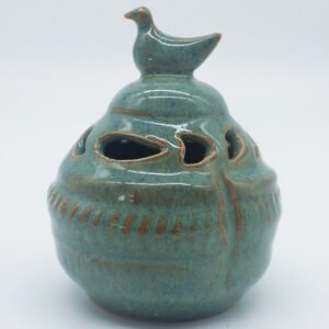 Gourd shaped ceramic incense burner in reactive sage glaze breaking to rust, with a pierced lid and bird finial